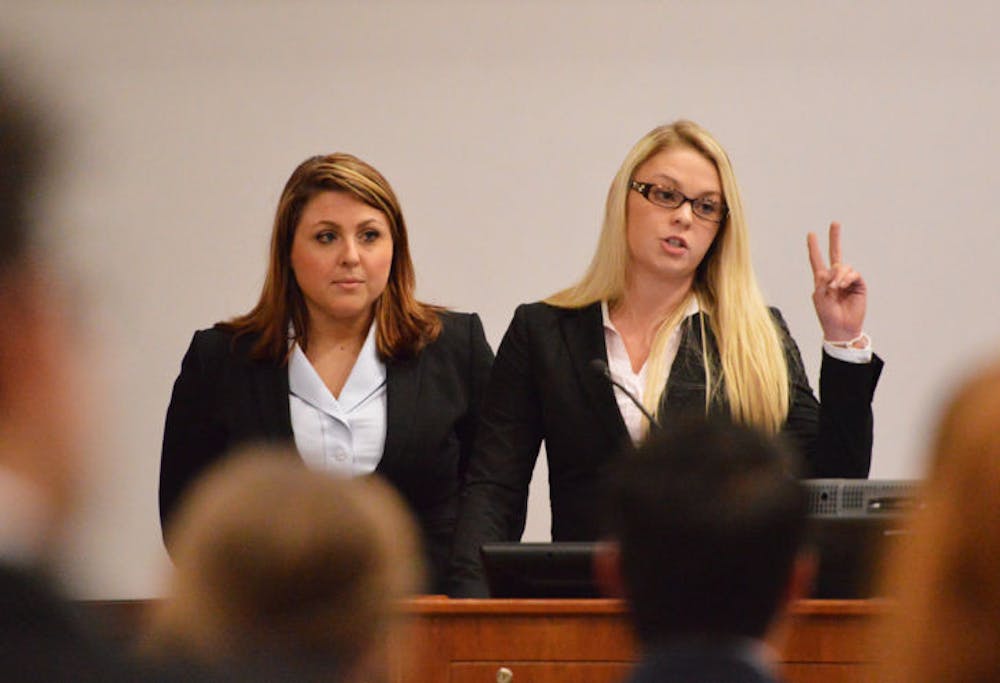 <p class="p1"><span class="s1">Alex Paez and Aubrey Burris speak about transparency issues when applying to be appointed as a UF Supreme Court justice at the Student Senate meeting Tuesday night.</span></p>