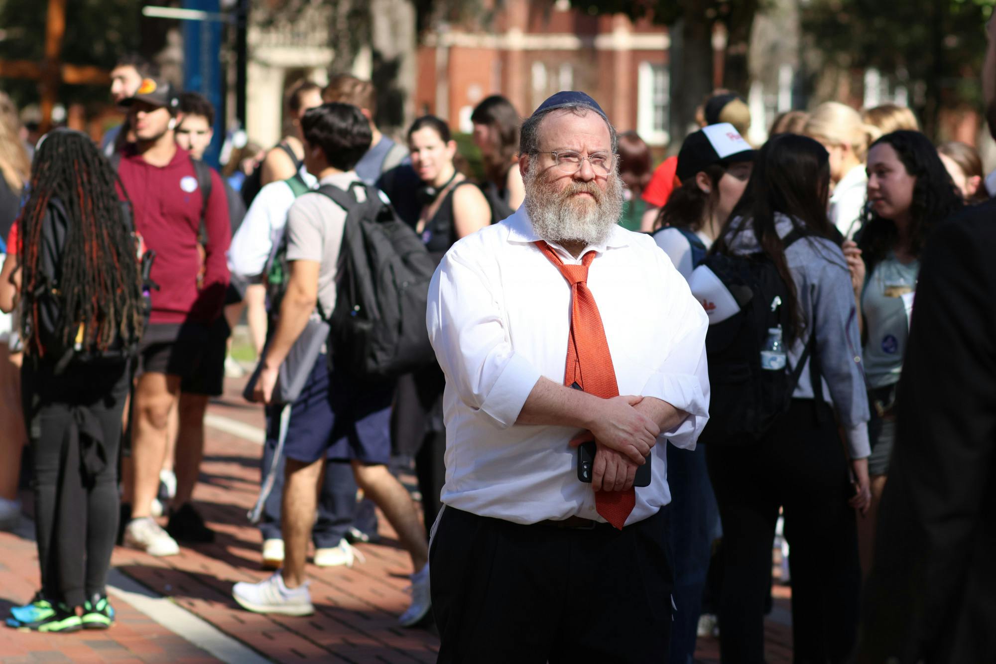 Rabbi Berl Goldman walks through the crowd of students gathered in Plaza of the Americas as an antisemitic group &quot;Ye is Right&quot; attempts to interview people on campus Thursday, Feb. 2, 2023. 