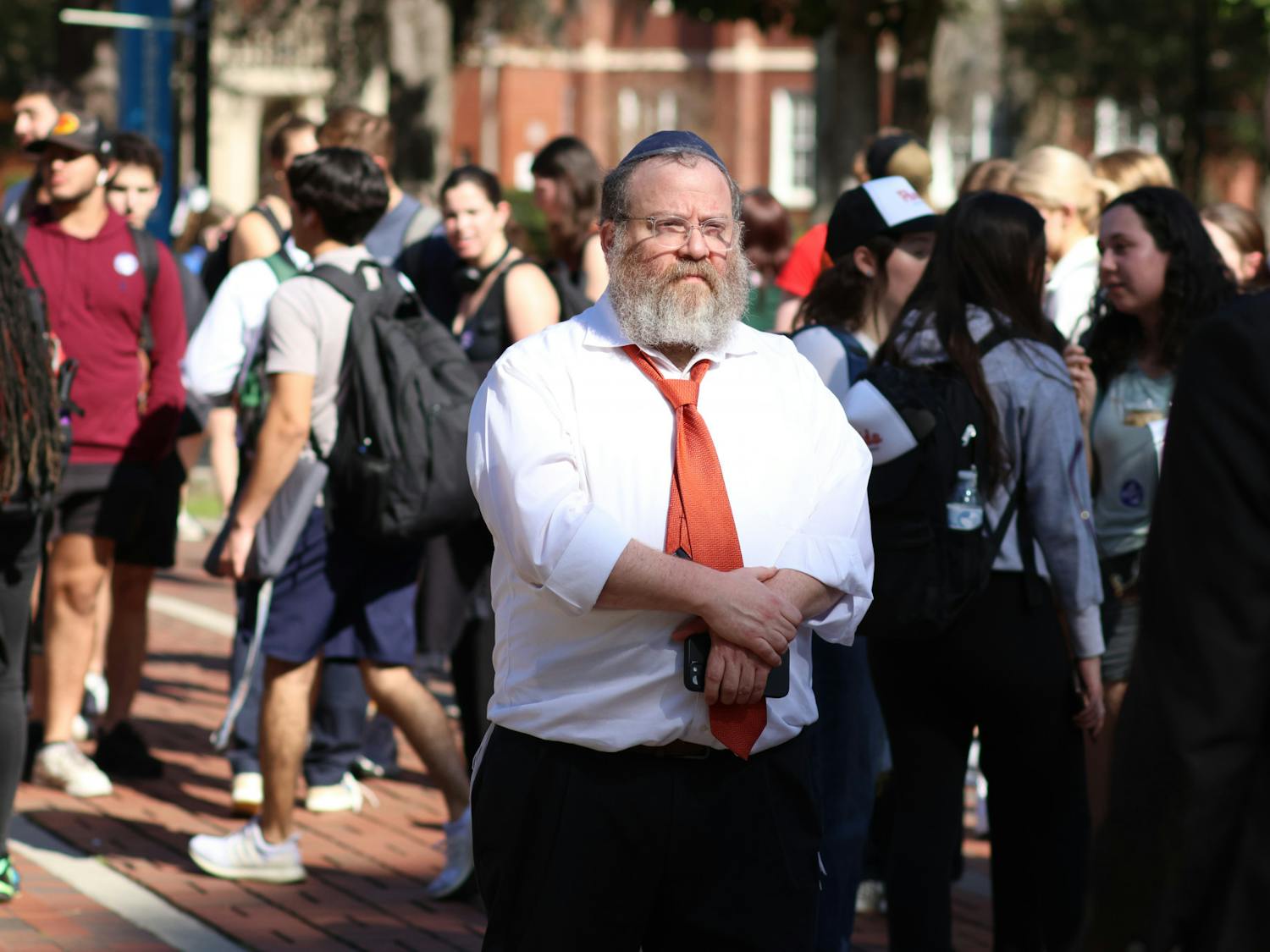 Rabbi Berl Goldman walks through the crowd of students gathered in Plaza of the Americas as an antisemitic group &quot;Ye is Right&quot; attempts to interview people on campus Thursday, Feb. 2, 2023. 