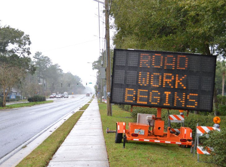 Signs placed on Northwest 16th Street indicate ongoing construction. Many sections of the street are scheduled for closure while the area undergoes improvements.