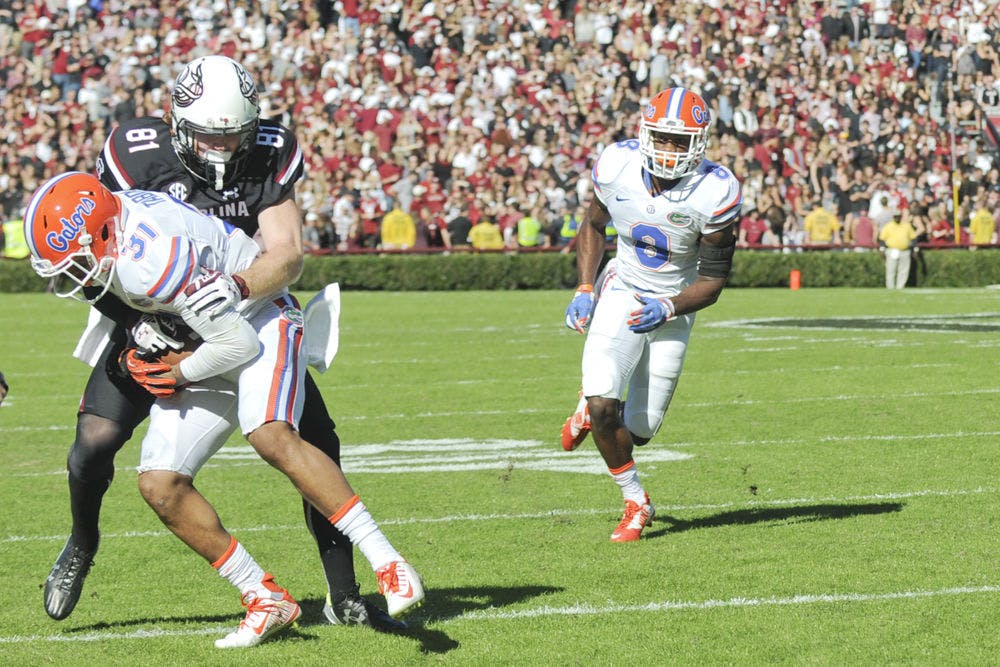 <p>UF defensive end Jalen Tabor intercepts a pass during Florida's 24-14 win against South Carolina on Nov. 14, 2015, in Columbia, South Carolina.</p>