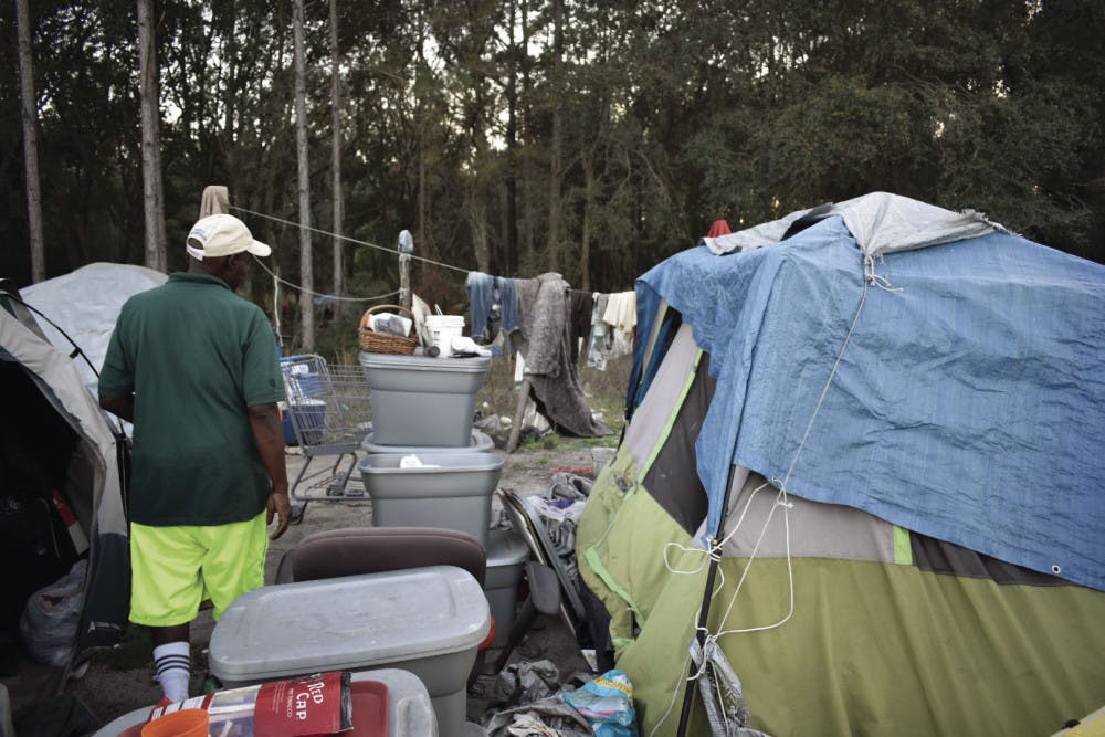 Rupert Heard, 55, gives a tour of his camp fit for three. As camp leader, he manages his group’s finances and stocks up on daily supplies.