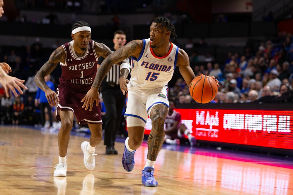 Florida Gators Guard Alijah Martin (15) drives towards the baseline during the first half against the Southern Illinois University Salukis at Exactech Arena at the Stephen C. O'Connell Center. on Friday, Nov. 22, 2024.