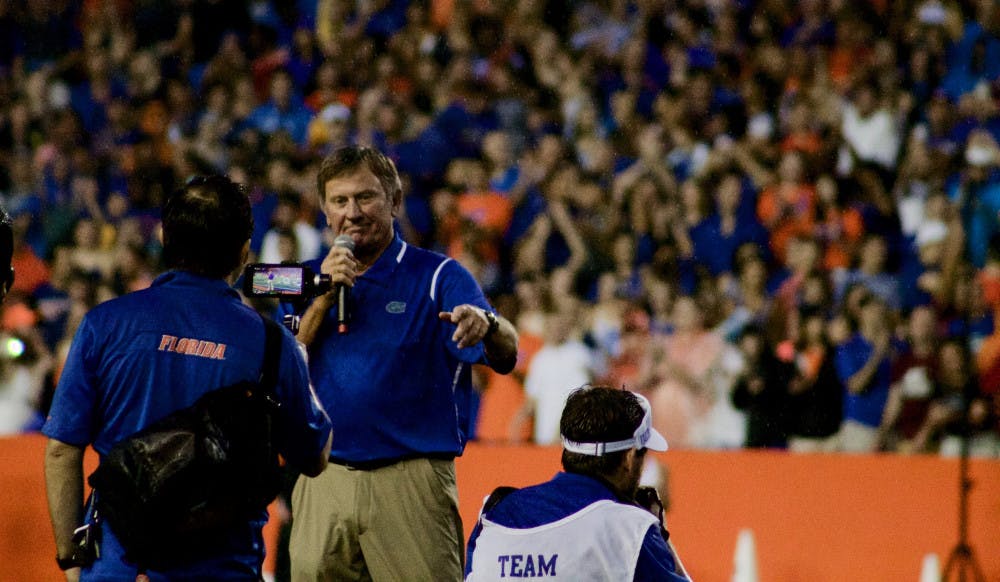 <p>Steve Spurrier talks to the crowd before the start of Florida's 24-7 win over Massachusetts on Sept. 4, 2016, at Ben Hill Griffin Stadium.</p>