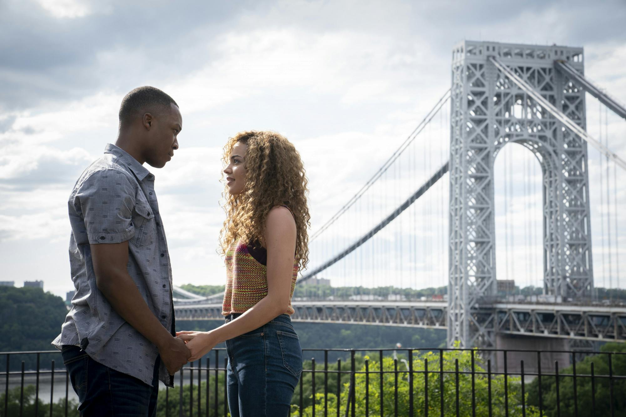 This image released by Warner Bros. Entertainment shows Corey Hawkins, left, and Leslie Grace in a scene from "In the Heights."   (Macall Polay/Warner Bros. Entertainment via AP)