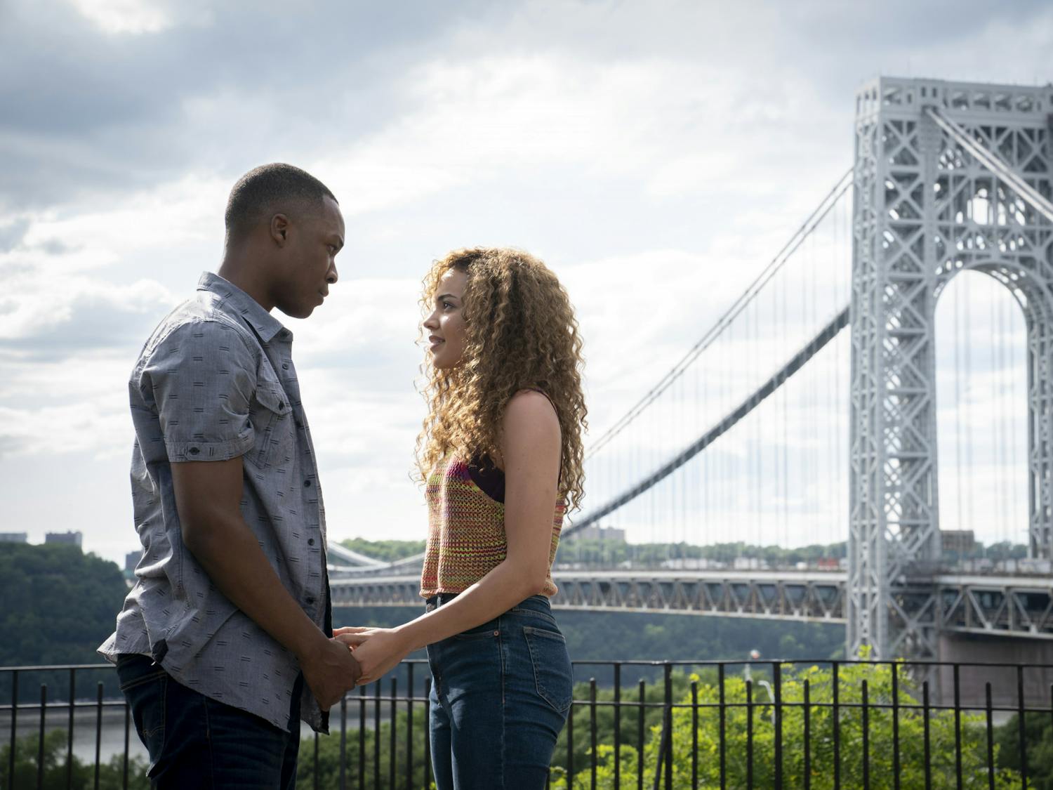 This image released by Warner Bros. Entertainment shows Corey Hawkins, left, and Leslie Grace in a scene from "In the Heights."   (Macall Polay/Warner Bros. Entertainment via AP)