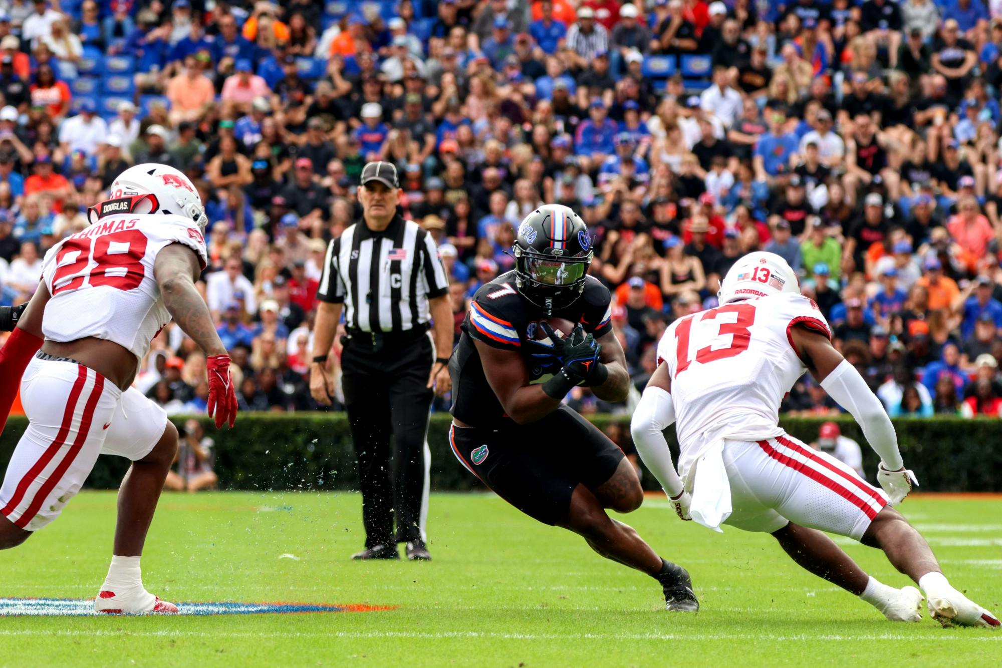 Sophomore running back Trevor Etienne runs the ball in the Gators&#x27; 39-36 loss to the Arkansas Razorbacks on Saturday, Nov. 4, 2023.