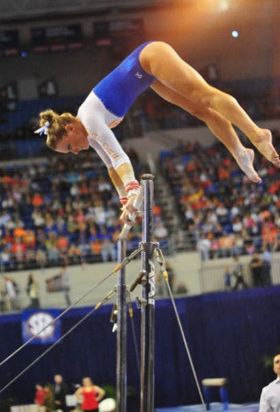 Freshman Bridget Sloan performs her bar routine during Florida's 198.10-196.85 win against Alabama on Feb. 8 in the O'Connell Center. Sloan won the all-around title at the SEC Championship meet on Saturday.