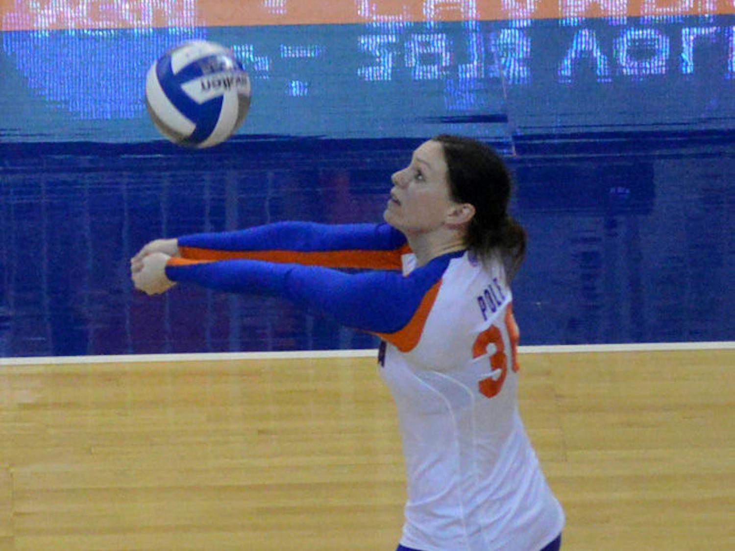 Holly Pole records a dig during Florida's 3-2 loss to Florida State on Dec. 6 in the second round of the NCAA Tournament in the O'Connell Center. Pole has 527 career digs and 52 career service aces heading into the 2014 season — her senior year.