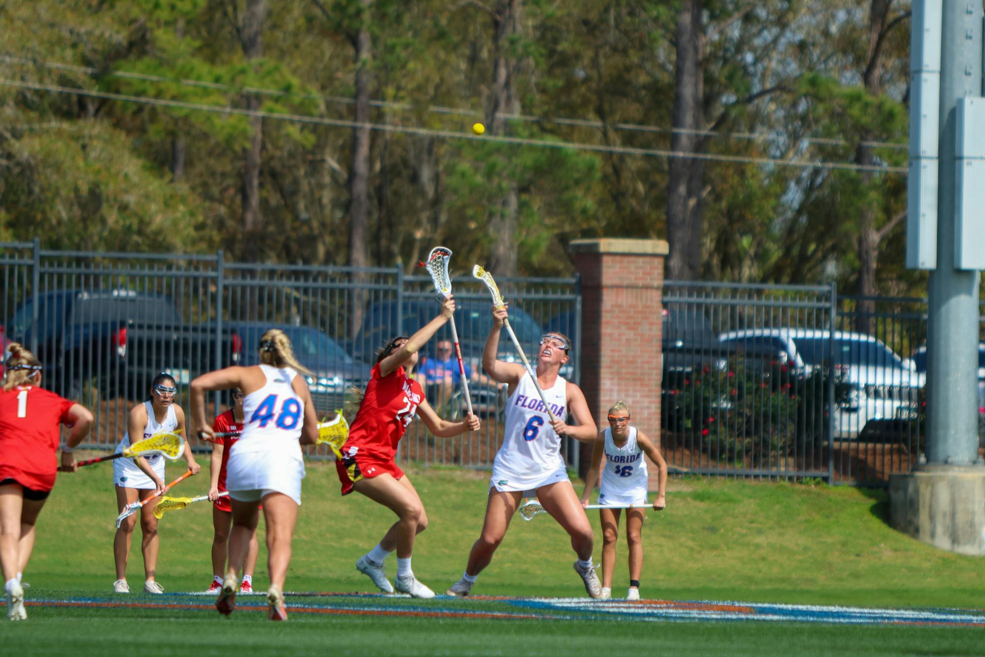 Florida attacker Liz Harrison fights for a draw control during the Gators' 14-13 loss to the Terrapins Saturday, Feb. 25, 2023