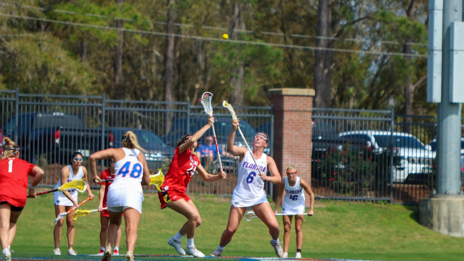 Florida attacker Liz Harrison fights for a draw control during the Gators' 14-13 loss to the Terrapins Saturday, Feb. 25, 2023
