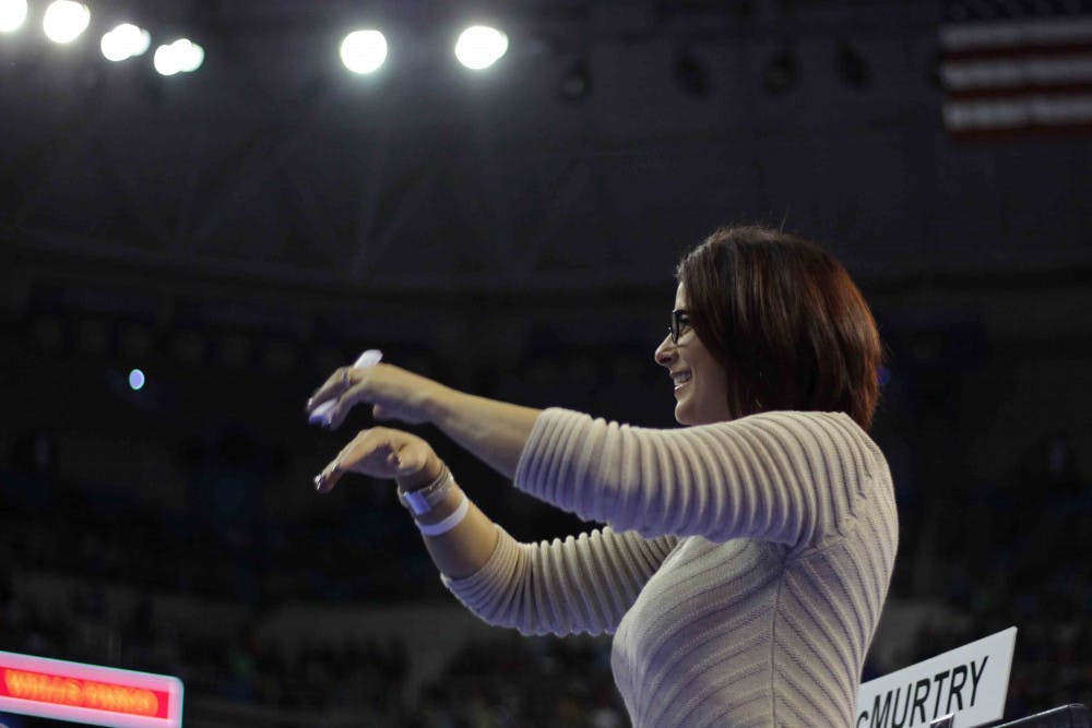 UF coach Jenny Rowland applauds after Alex McMurtry’s balance beam routine during Florida’s win against Alabama on Jan. 29, 2016, in the O’Connell Center.