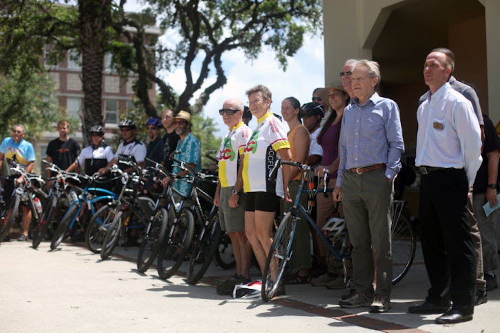 <p dir="ltr">Participants in a closing event for National Bike Month gather in front of the Alachua County Library Headquarters Thursday.</p>
<div>&nbsp;</div>