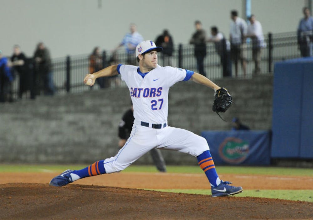 <p>Aaron Rhodes pitches during Florida’s 3-1 win against Florida State on March 18 at McKethan Stadium.&nbsp;</p>