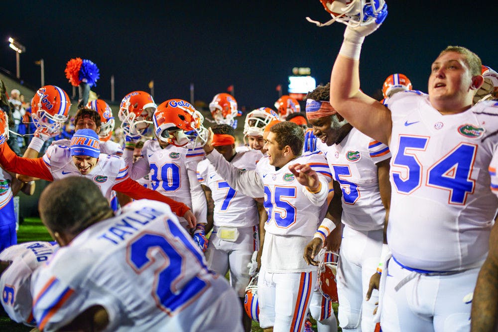 Florida players celebrate following the Gators' 34-10 win against Vanderbilt on Saturday in Nashville, Tennessee.
