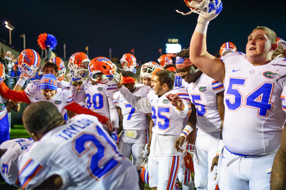 <p>Florida players celebrate following the Gators' 34-10 win against Vanderbilt on Saturday in Nashville, Tennessee.</p>