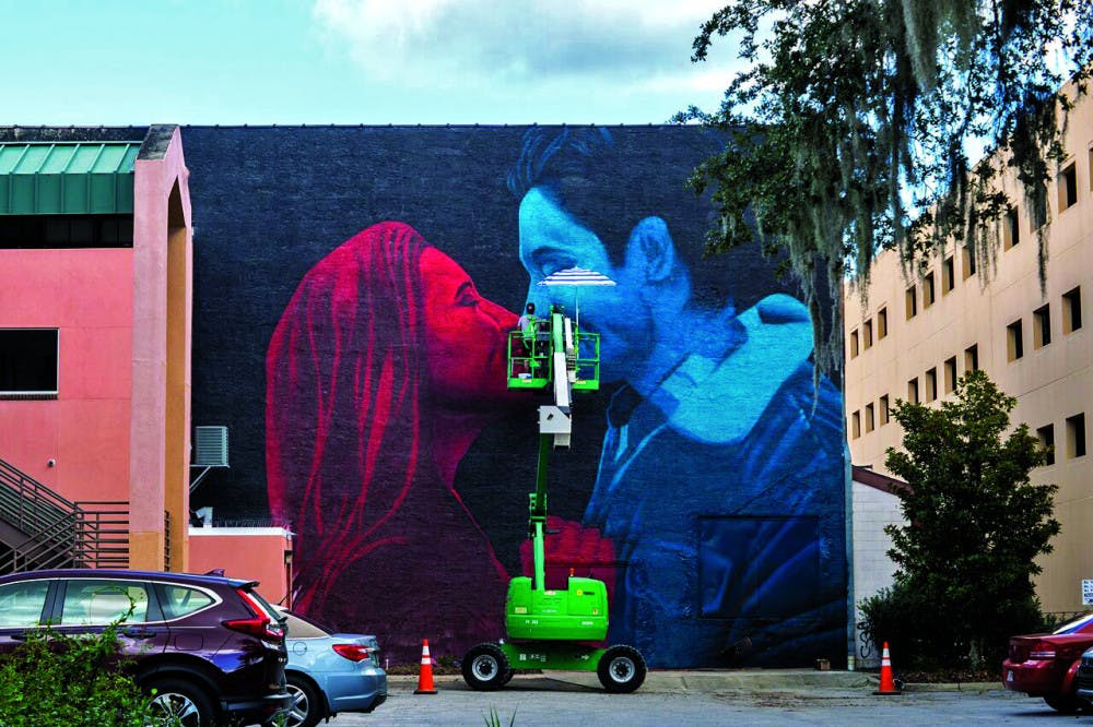 The 3D art mural at the wall behind the Florida Theatre on West University Avenue was revealed Sunday afternoon. It cost $10,000 to pay for the materials and the artist to fly in from Greece.
