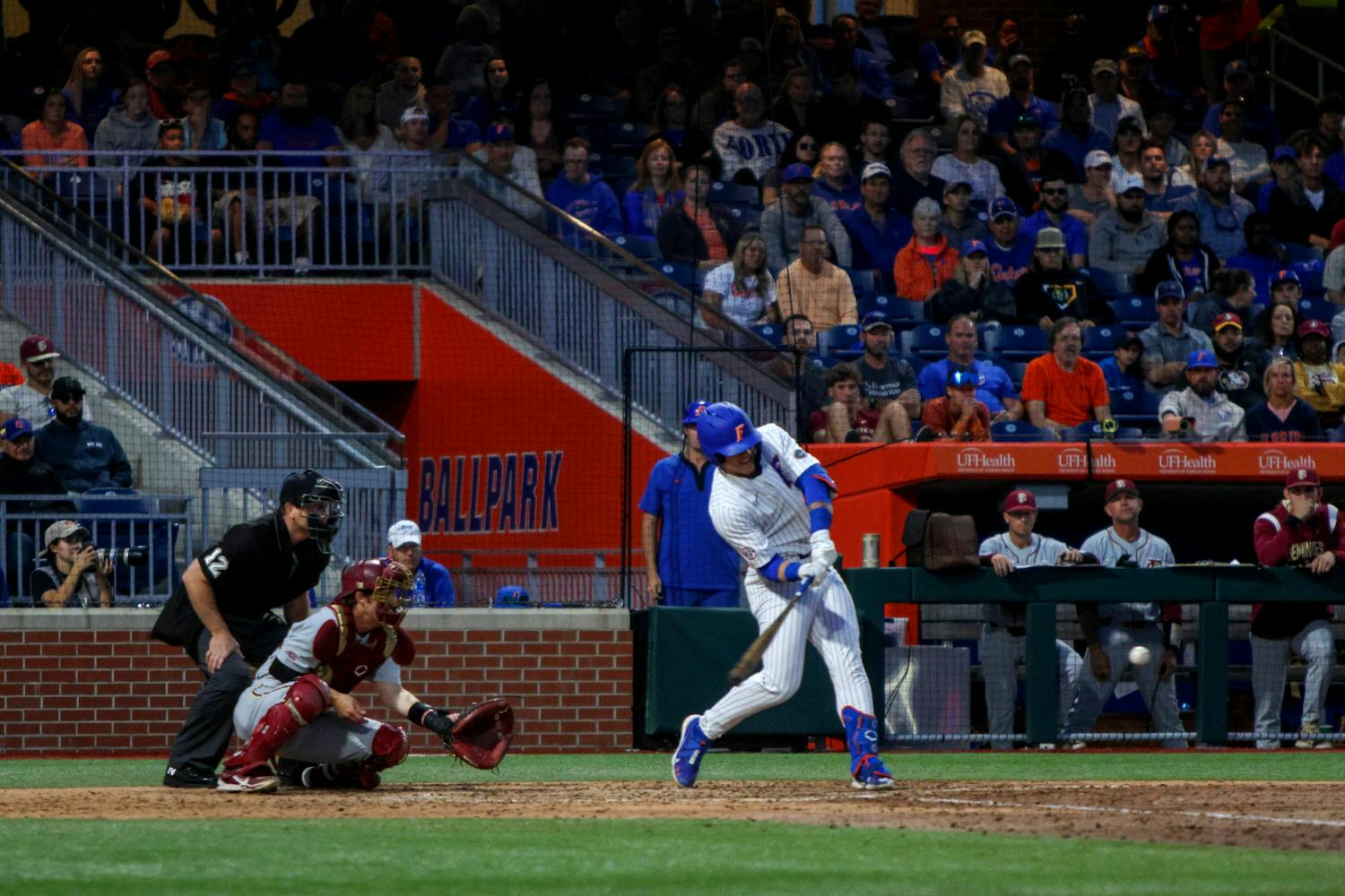 Florida outfielder Ty Evans hits a three-run home run in the Gators' 5-3 win against the Florida State Seminoles Tuesday, April 11, 2023.