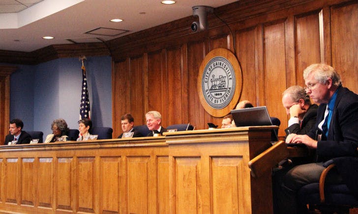 Gainesville City Commissioners discuss the current neighborhood parking decal system Thursday. They unanimously passed a resolution to explore options of raising parking permit prices.