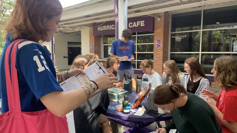 <p>Youth Action Fund campus coordinator at Gainesville High School, Mira Lemstrom, (pictured on the left) registers students to vote during lunch period on Aug. 22, 2024.</p>