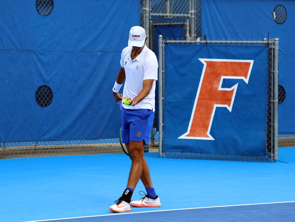 <p>Senior Lorenzo Claverie prepares to serve at Florida's spring opening match against South Florida, in Gainesville, Fla., Saturday, Jan. 17, 2026.</p>
