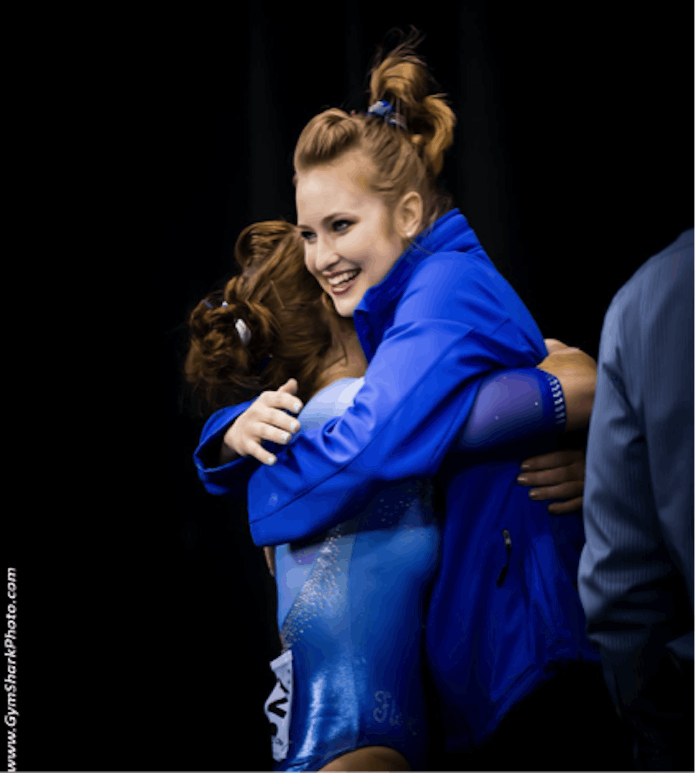 <p>UF gymnast Claire Boyce hugs former teammate Bridget Sloan during the 2016 NCAA Super Six on April 16, 2016, in Fort Worth, Texas.</p>