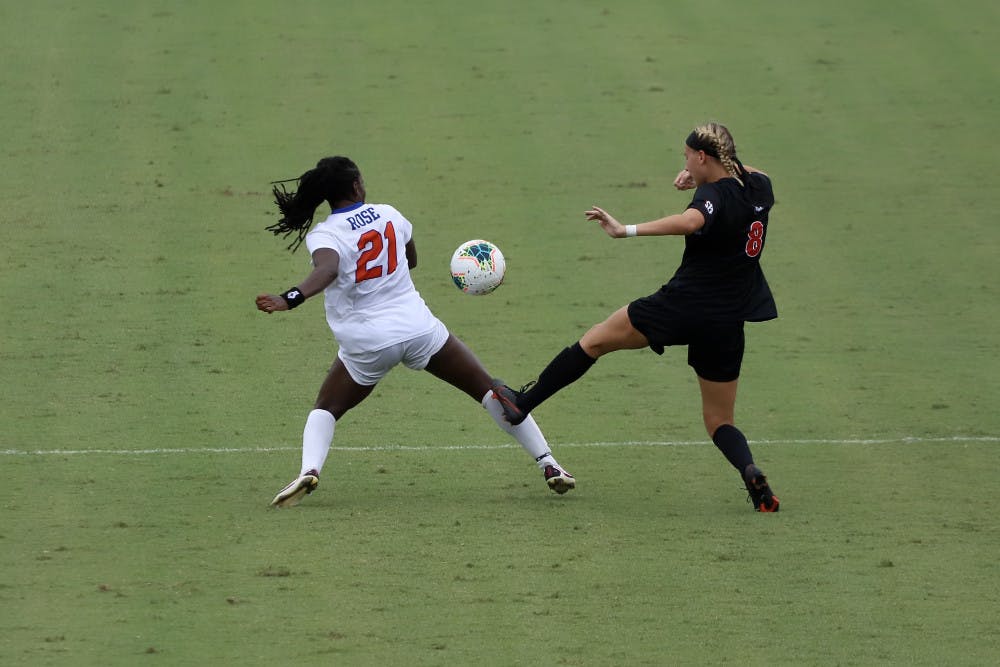 Forward Deanne Rose fights for a ball at Florida's game against Georgia earlier this season. The senior's return will be a key factor in the Gators' game against South Carolina Sunday.