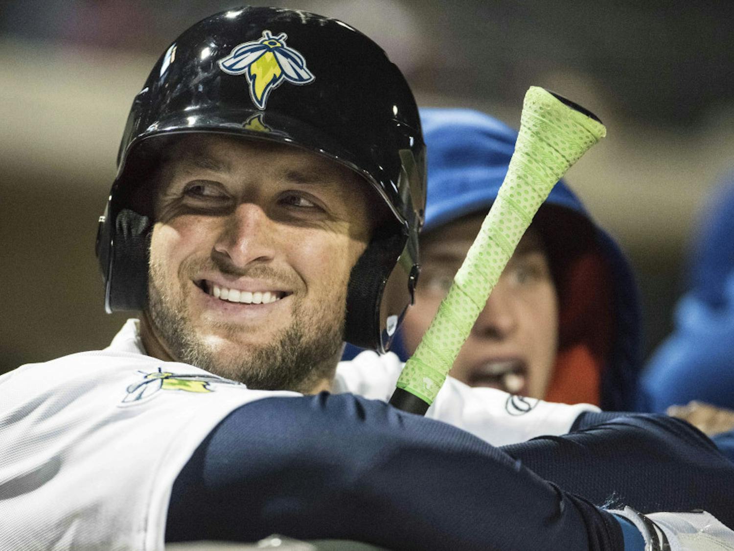 Columbia Firefly outfielder Tim Tebow shares a smile with fans during a Class A minor league baseball game against the Augusta GreenJackets on Thursday, April 6, 2017, in Columbia, S.C. Columbia defeated Augusta 14-7. (AP Photo/Sean Rayford)