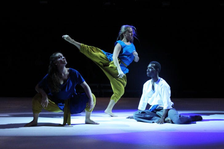 Lauren Hoefer, 20, Channing Malz, 20, and Cornelius Pride, 24, rehearse a dance for “Dance 2013: Drop” in the Nadine Mcguire Black Box Theatre&nbsp;on Wednesday night. “Dance 2013: Drop” premieres today at 7:30 p.m. and runs until Feb. 24. Tickets are available at the University Box Office.