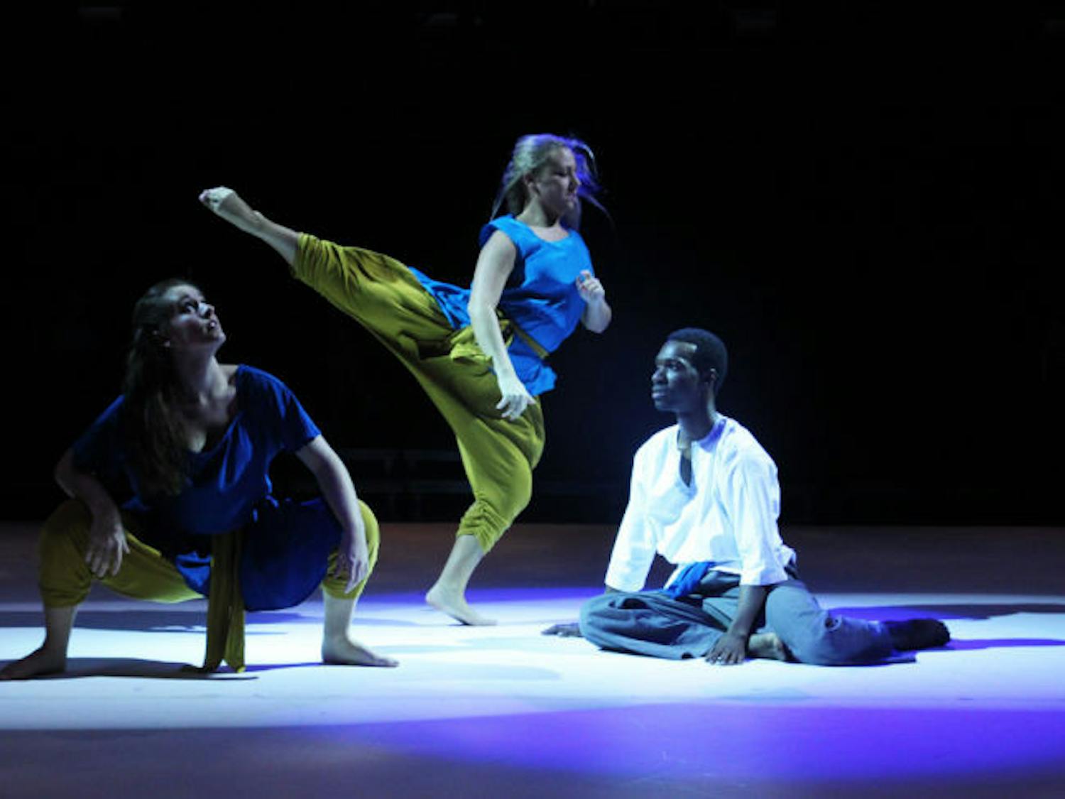 Lauren Hoefer, 20, Channing Malz, 20, and Cornelius Pride, 24, rehearse a dance for “Dance 2013: Drop” in the Nadine Mcguire Black Box Theatre&nbsp;on Wednesday night. “Dance 2013: Drop” premieres today at 7:30 p.m. and runs until Feb. 24. Tickets are available at the University Box Office.