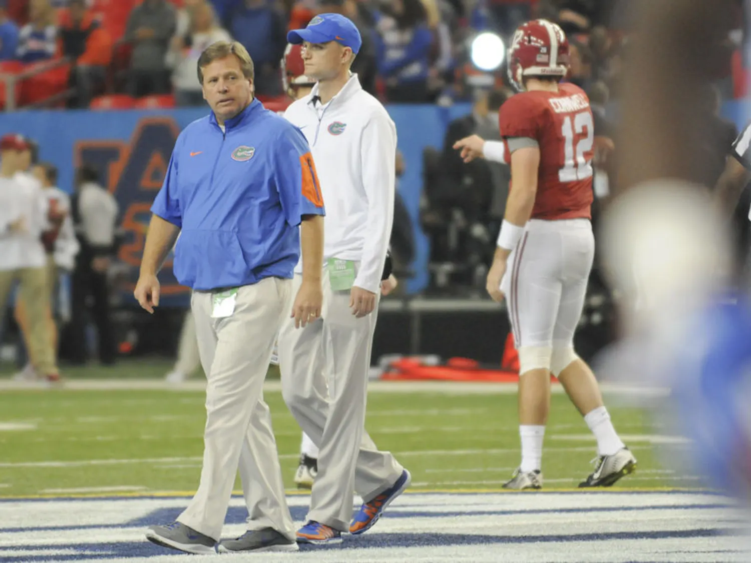 Jim McElwain walks on the field of the Georgia Dome during warmups prior to Florida's 29-15 loss to Alabama in the 2015 SEC Championship Game.