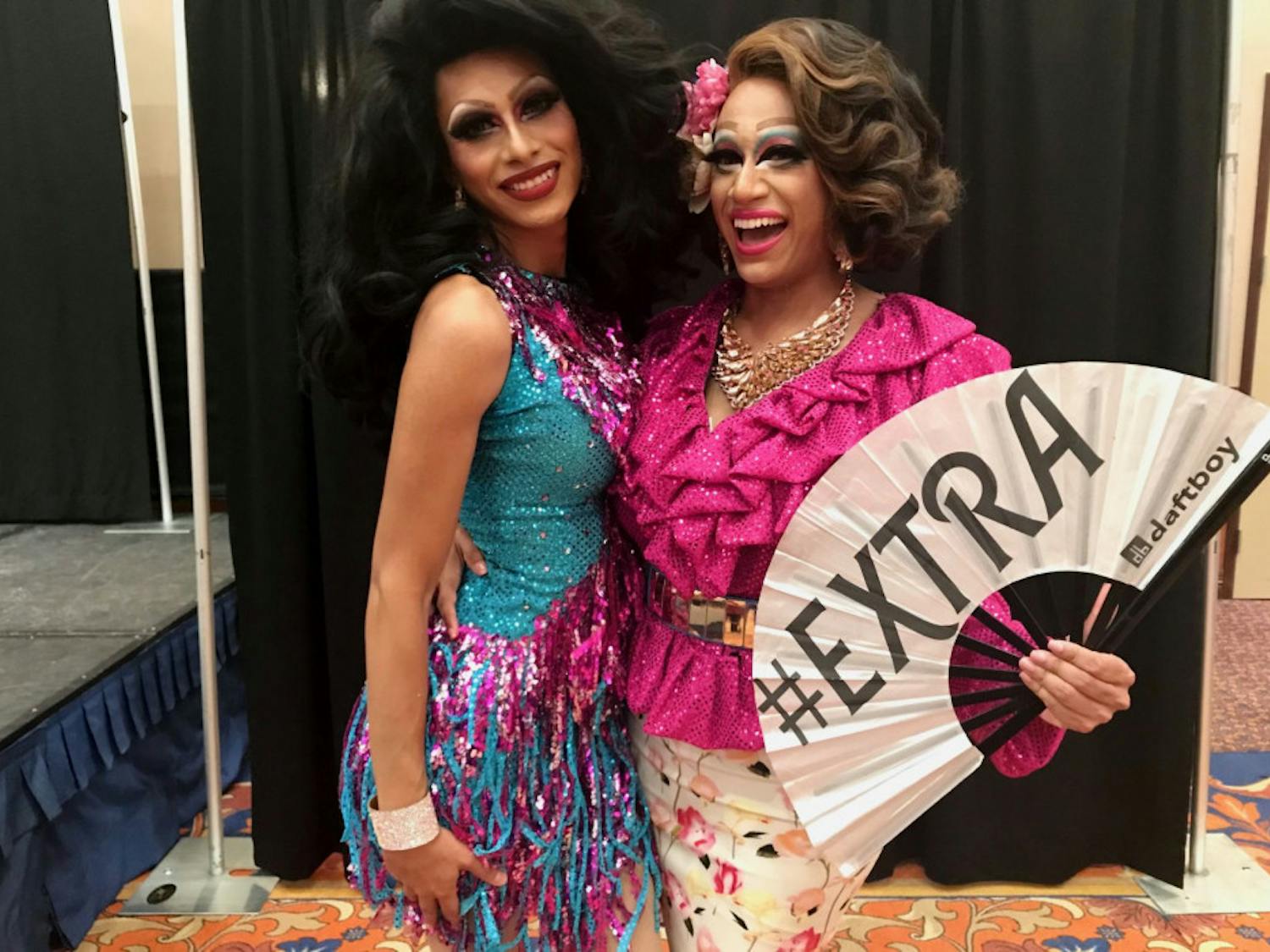 Deafies in Drag stars Casa Vina (left) and Selena Minogue (right) pose with their fan.