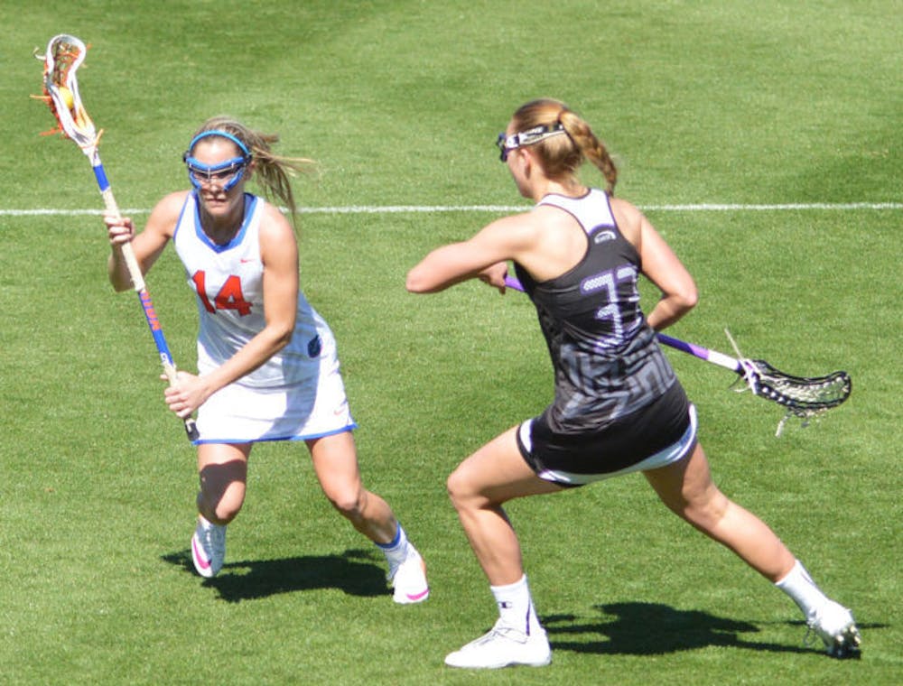 <p>Nora Barry drives the ball toward the net during Florida’s 18-7 win against High Point on Feb. 15 at Donald R. Dizney Stadium. Barry scored the game-winning goal against Northwestern on Sunday to help the Gators clinch the American Lacrosse Conference Tournament title.</p>