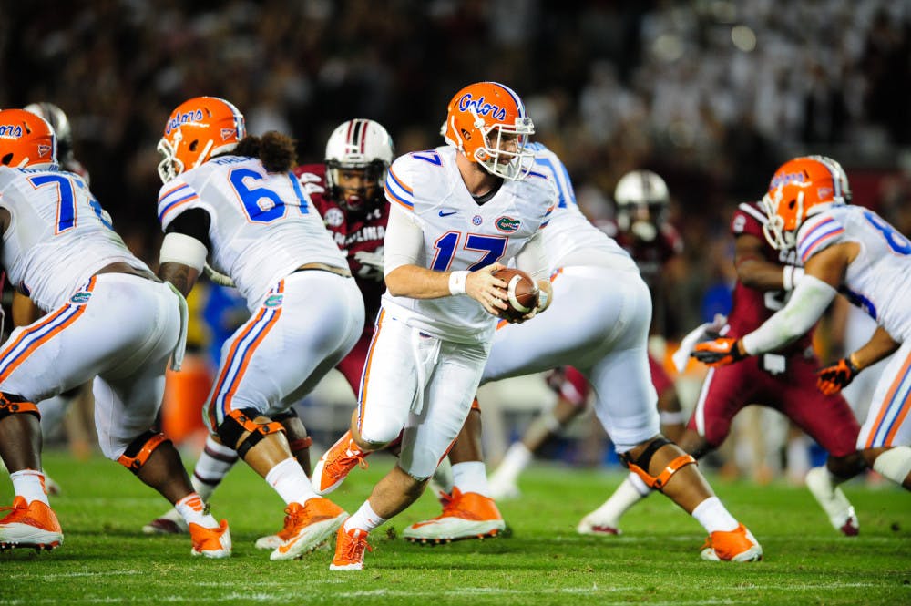 <p>Redshirt freshman quarterback Skyler Mornhinweg (17) prepares to hand the ball off during Florida's 19-14 loss to No. 10 South Carolina on Saturday night at Williams-Brice Stadium in Columbia, S.C.</p>