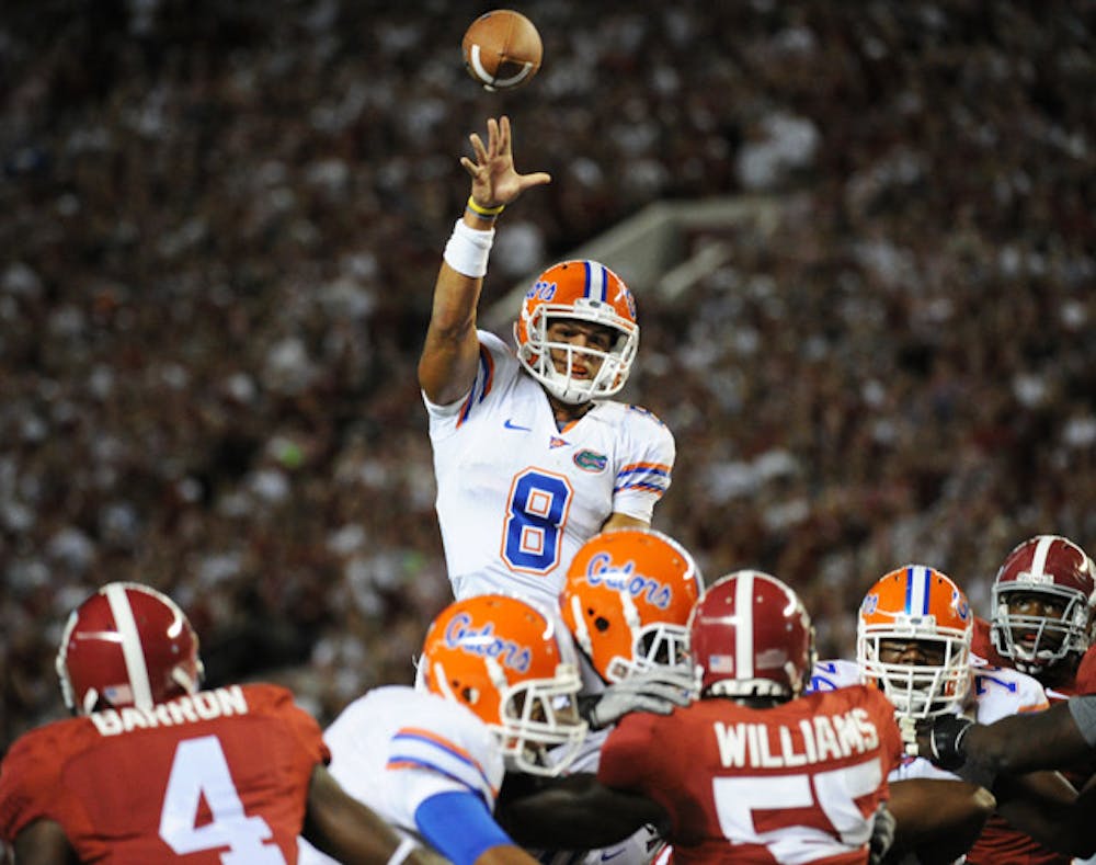 <p>Trey Burton (8) threw an interception on Florida’s first drive in a loss to Alabama last season. Safety Josh Evans said the costly turnover broke down the Gators mentally, causing the team to lose focus.</p>