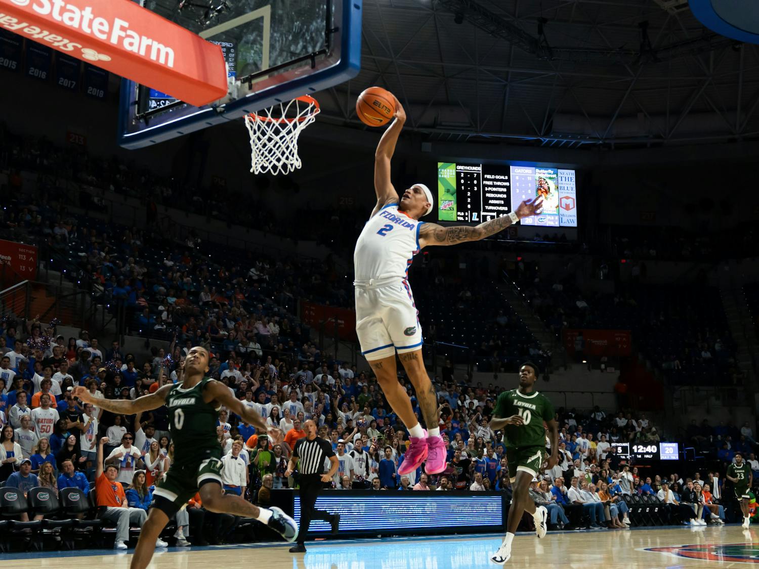 Sophomore guard Riley Kugel dunks the ball in the Gators' 93-73 win against the Loyola Maryland Greyhounds on Monday, Nov. 6, 2023.