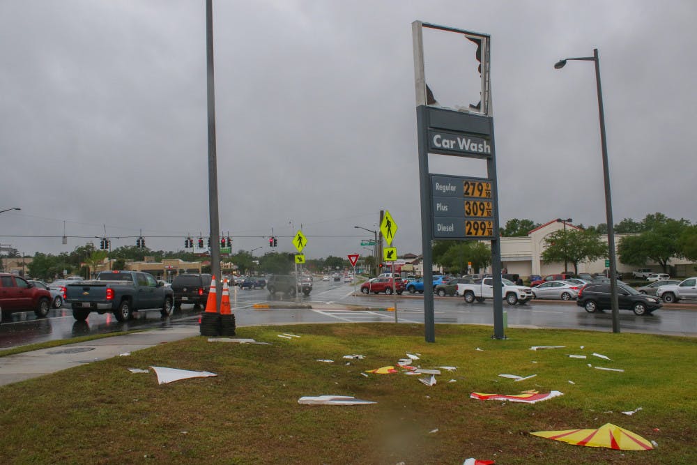 <p><span id="docs-internal-guid-fa5f594e-7fff-ca95-4bc0-640795ed6e4a"><span>The Shell sign is scattered across the ground Friday after strong winds blew it down during a storm at the Shell gas station, 3330 SW Archer Road. Daphne Roberson, an employee at the station, said she saw the sign go down around 11 a.m. “It just all of a sudden happened,” she said. “I looked up and it was flying across the air.”</span></span></p>