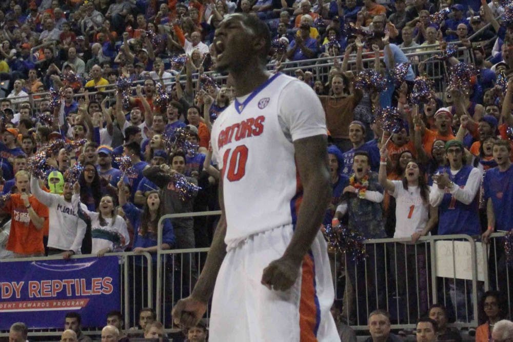 Dorian Finney-Smith screams after a dunk during Florida’s win over West Virginia on Jan. 30, 2016, in the O’Connell Center.