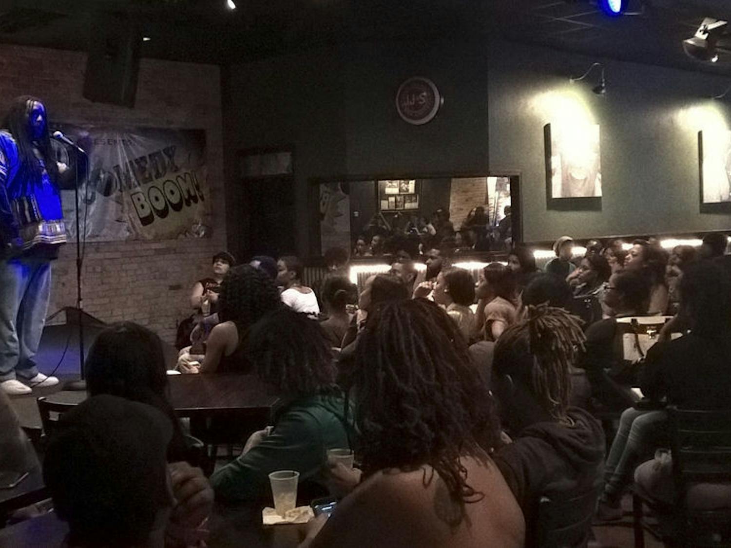 Huggy Bear Da Poet, a spoken word artist, performs at Rockeys Dueling Piano Bar during the “Black Euphoria” open mic night on Tuesday.