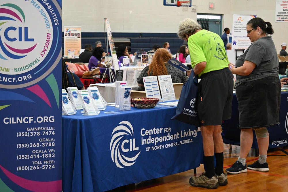 Alachua County residents speak with vendors at a disability awareness expo in Gainesville, Fla., Wednesday, July 29, 2026.