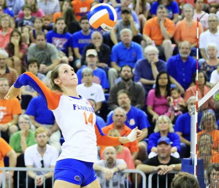 Senior middle blocker Betsy Smith attempts to spike the ball over the net during Florida's 3-0 victory against Missouri on Sept. 21 at the O'Connell Center. Her leadership has helped the young Gators communicate on the court.