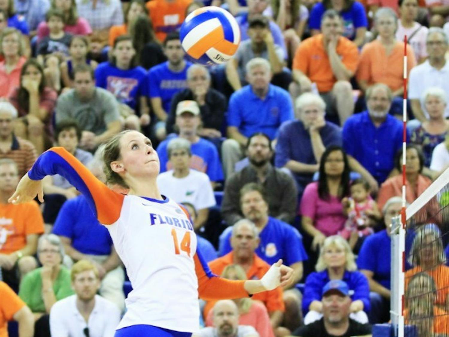 Senior middle blocker Betsy Smith attempts to spike the ball over the net during Florida's 3-0 victory against Missouri on Sept. 21 at the O'Connell Center. Her leadership has helped the young Gators communicate on the court.