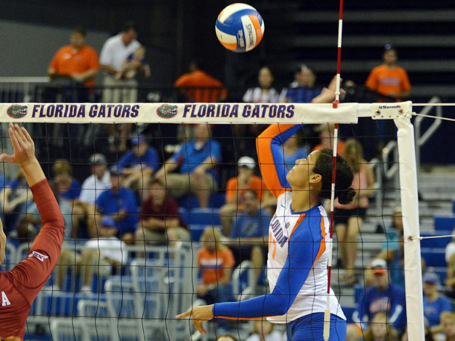 Noami Santos-Lamb swings for a kill attempt during Florida's 3-2 win against Oklahoma on Aug. 30, 2014, in the O'Connell Center.