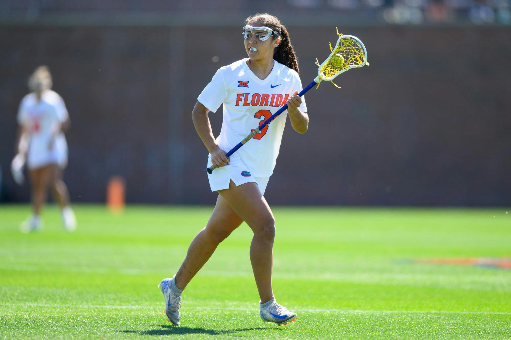 Florida attacker Autumn Blair (3) runs during the first half of an NCAA lacrosse match against Michigan, Friday, Feb. 13, 2026, in Gainesville, Fla.