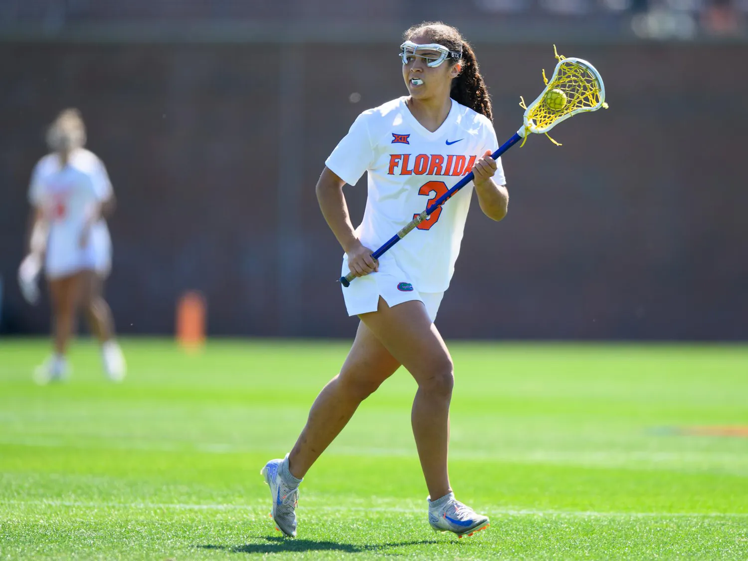 Florida attacker Autumn Blair (3) runs during the first half of an NCAA lacrosse match against Michigan, Friday, Feb. 13, 2026, in Gainesville, Fla.