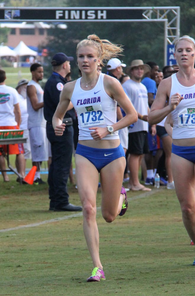 Senior Agata Strausa (left) races at the Mountain Dew Invitational on Sept. 14 in Gainesville. 