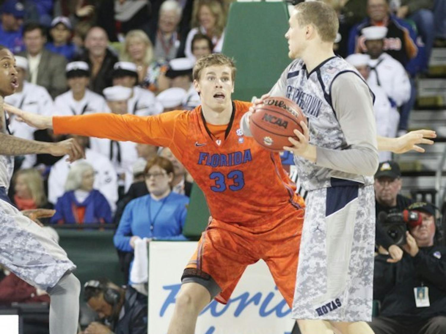 Florida forward Erik Murphy (33) guards Georgetown forward Nate Lubick during the Navy-Marine Corps Classic on Friday aboard the USS Bataan in Jacksonville.