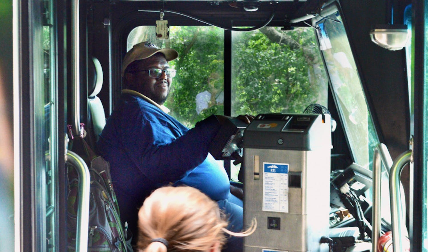 Desmond Grimes, 38, welcomes students onto the 117 Bus at the Reitz Union. Grimes’ route, “Park-N-Ride 2,” circulates through 34th Street back to the Reitz Union.   
