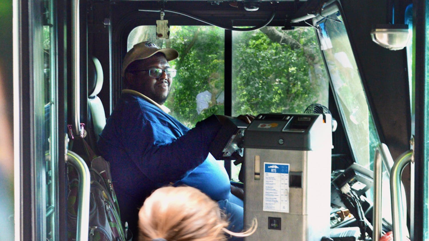 Desmond Grimes, 38, welcomes students onto the 117 Bus at the Reitz Union. Grimes’ route, “Park-N-Ride 2,” circulates through 34th Street back to the Reitz Union.   