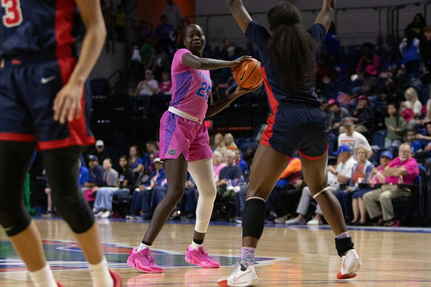 Faith Dut looks to pass the ball in the Gators women's basketball team's loss to the Ole Miss Rebels on Thursday, February 15, 2024. 